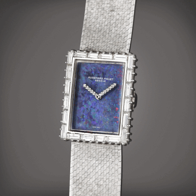 View full screen - View 1 of Lot 94. Reference 8437BC | A white gold and diamond-set bracelet watch with opal dial, Circa 1974.