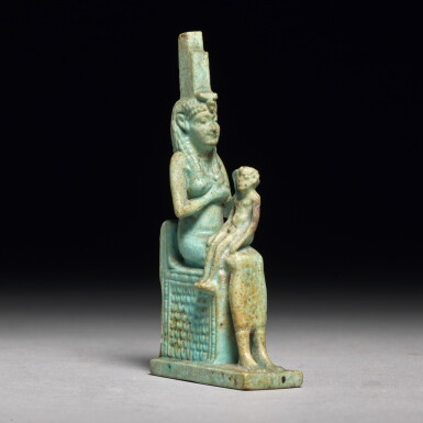 View full screen - View 1 of Lot 66. AN EGYPTIAN TURQUOISE FAIENCE FIGURE OF ISIS WITH HORUS, PTOLEMAIC PERIOD, 304-30 B.C..