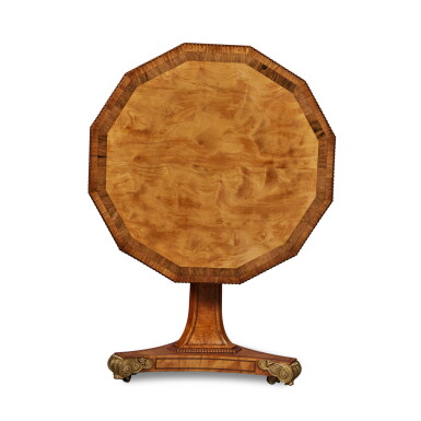 View full screen - View 1 of Lot 27. A Regency Gilt-Bronze Mounted Satinwood and Rosewood Inlaid Polygonal Tilt-Top Table, Circa 1820.