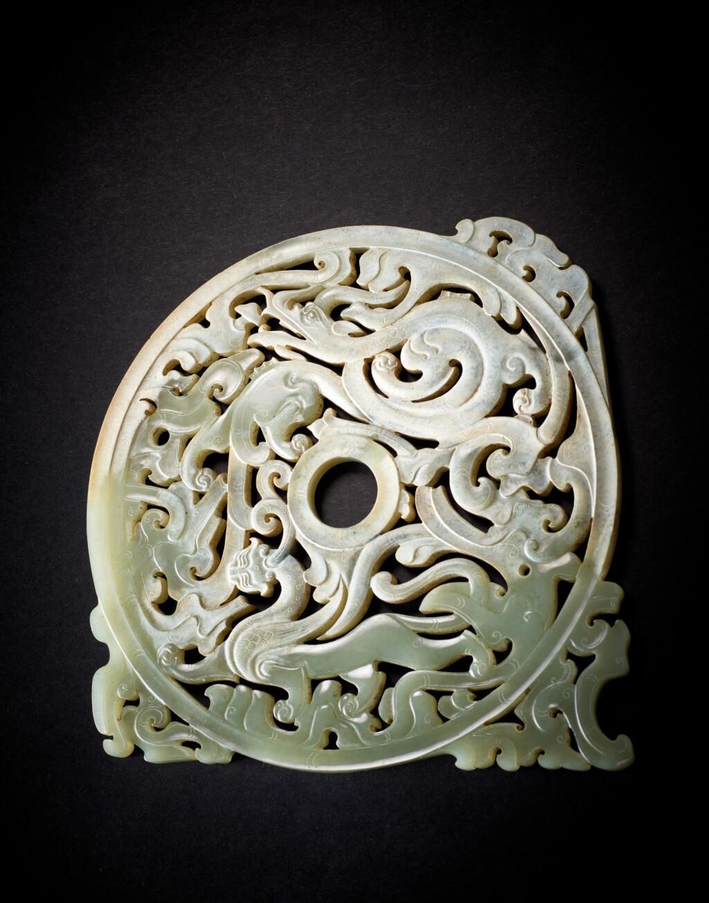 View full screen - View 1 of Lot 3811. A large reticulated pale celadon jade bi disc, Eastern Han dynasty | 東漢 青白玉鏤空出廓璧.