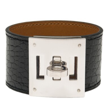 View full screen - View 1 of Lot 66. Hermès Black Shiny Mississippiensis Alligator Kelly Dog Bracelet with Palladium Hardware.