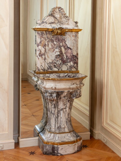View full screen - View 1 of Lot 38. A partly Louis XV fleur de pêcher marble and gilt-bronze fountain, circa 1750 | Fontaine en marbre fleur de pêcher et bronze doré en partie d'époque Louis XV, vers 1750.