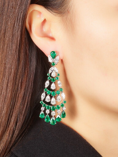 View full screen - View 1 of Lot 1050. Pair of Emerald and Diamond Pendent Earrings | 格拉夫| 祖母綠 配 鑽石 耳墜一對 (祖母綠及鑽石共重約14.70及12.50克拉).