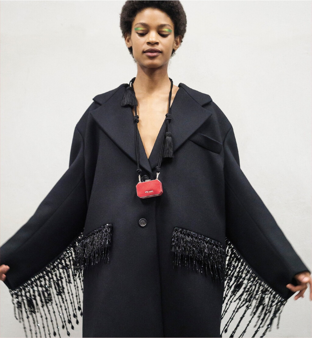View full screen - View 1 of Lot 8. PRADA | WOOL BEADED FRINGE COAT AND VANITY NECKLACE, WORN BY THERESA HAYES.