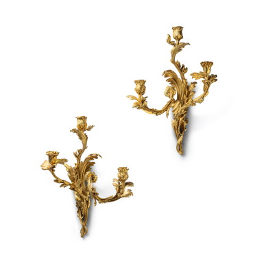 View full screen - View 1 of Lot 262. A pair of Louis XV style gilt-bronze three-light wall lights, circa 1850.