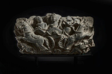 View full screen - View 1 of Lot 812. A gray schist relief of Surya atop his chariot, Ancient region of Gandhara, 3rd century.