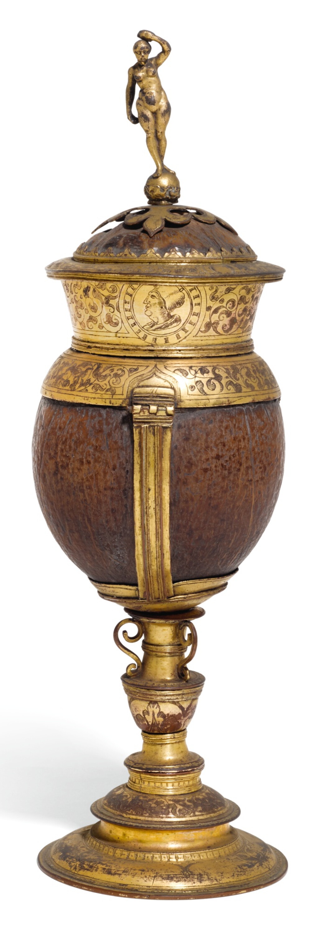 View full screen - View 1 of Lot 141. A GERMANIC GILT-COPPER MOUNTED COCONUT CUP AND COVER, UNMARKED, CIRCA 1590.