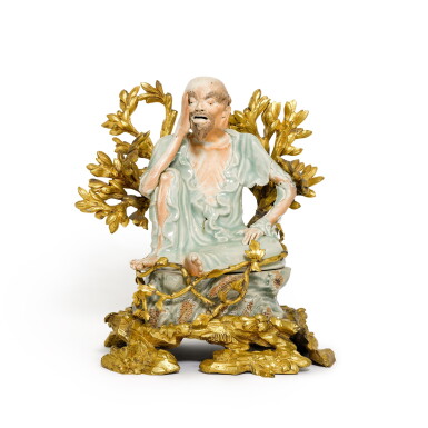 View full screen - View 1 of Lot 23. A gilt-bronze mounted celadon and biscuit porcelain figure of a Buddhist Rakan, the porcelain Japanese second half 17th century, the mounts French mid-18th century.