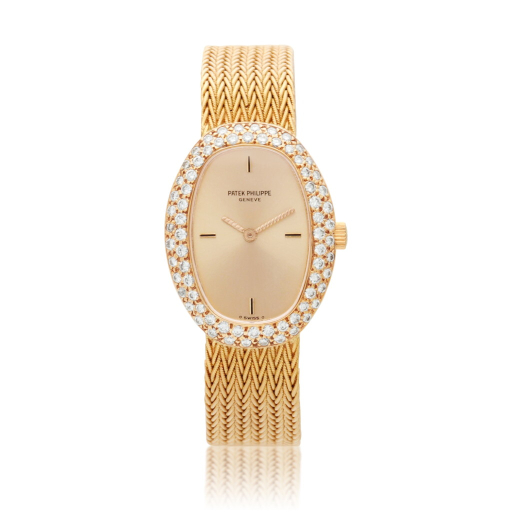View full screen - View 1 of Lot 164. Reference 4500-1, A yellow gold and diamond set bracelet watch, Circa 1980.
