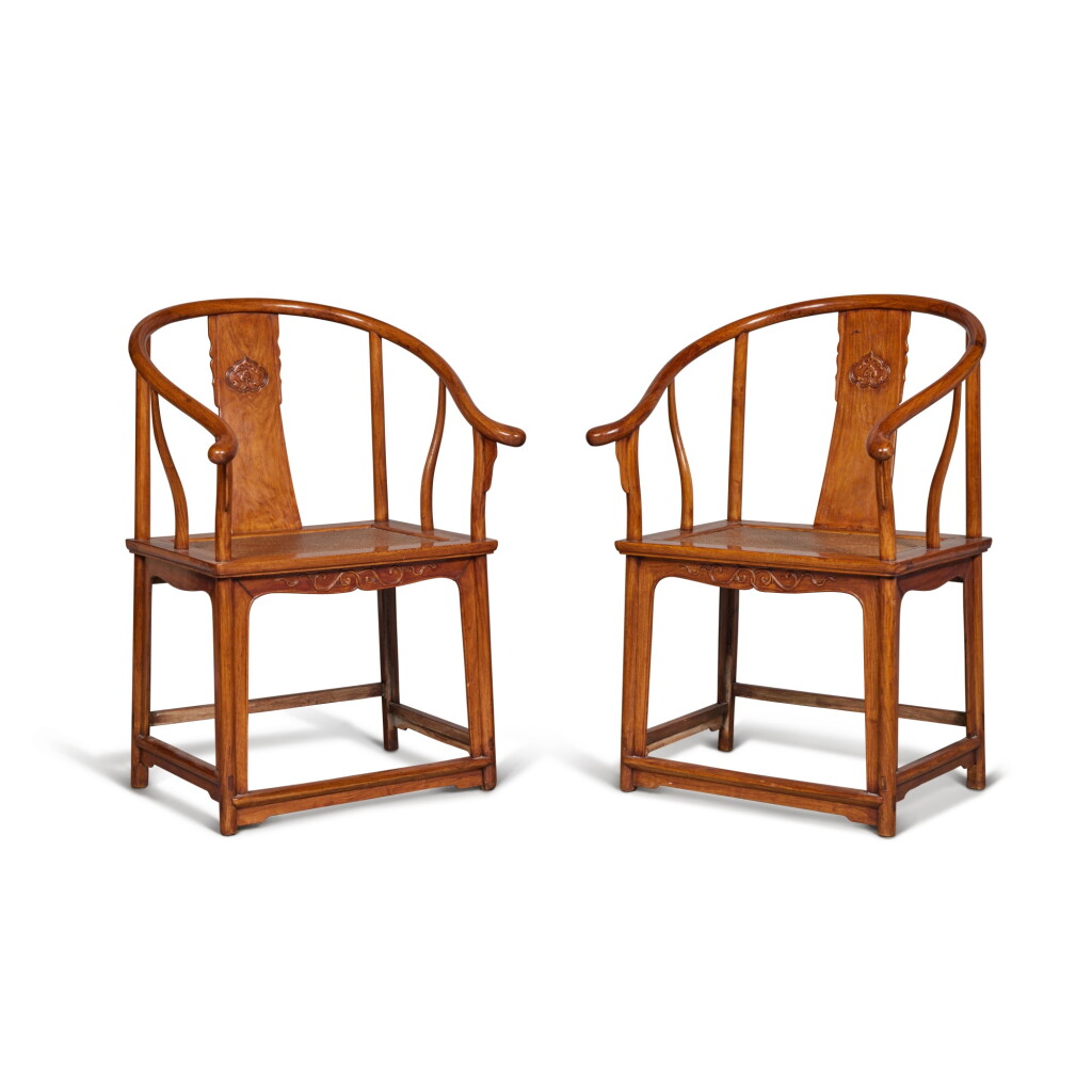 View full screen - View 1 of Lot 47. A pair of 'huanghuali' horseshoe-back armchairs (Quanyi), 17th / 18th century.