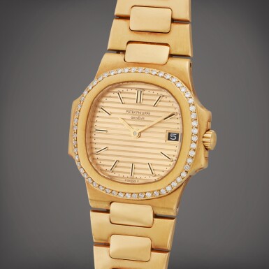 View full screen - View 1 of Lot 40. Reference 4700/2 Nautilus | A yellow gold and diamond-set wristwatch with date and bracelet, Circa 1990.