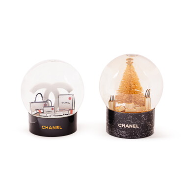 View full screen - View 1 of Lot 528. Golden Christmas Tree Snow Globe and CC Snow Globe.