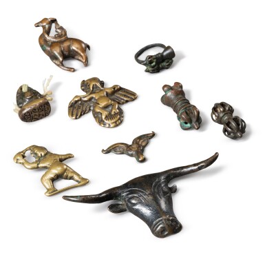 View full screen - View 1 of Lot 85. A group of nine copper-alloy ornaments, Tokcha Tibet, 12th-14th century | 西藏 十二至十四世紀 合金銅托查一組九件.