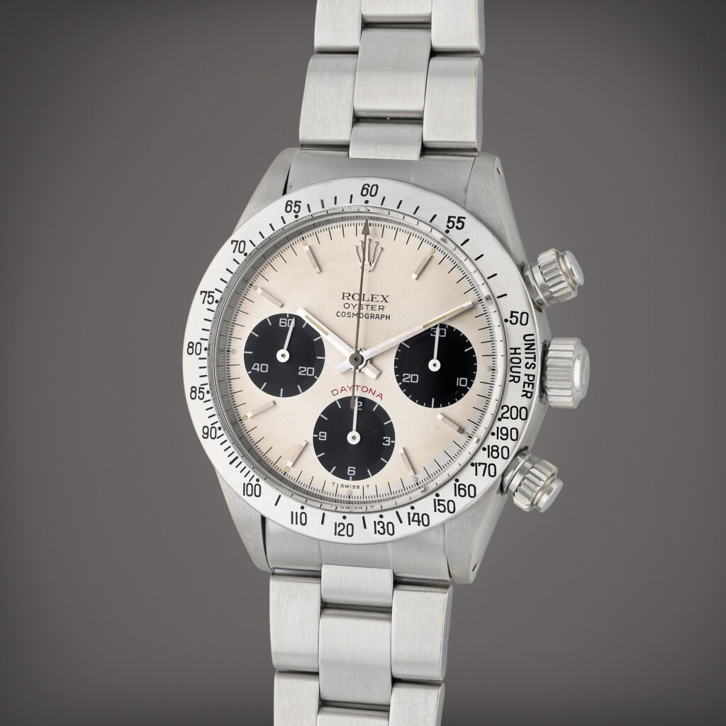 View full screen - View 1 of Lot 285. Reference 6265 Daytona ‘Small Red’ | A stainless steel chronograph wristwatch with bracelet, 1979.