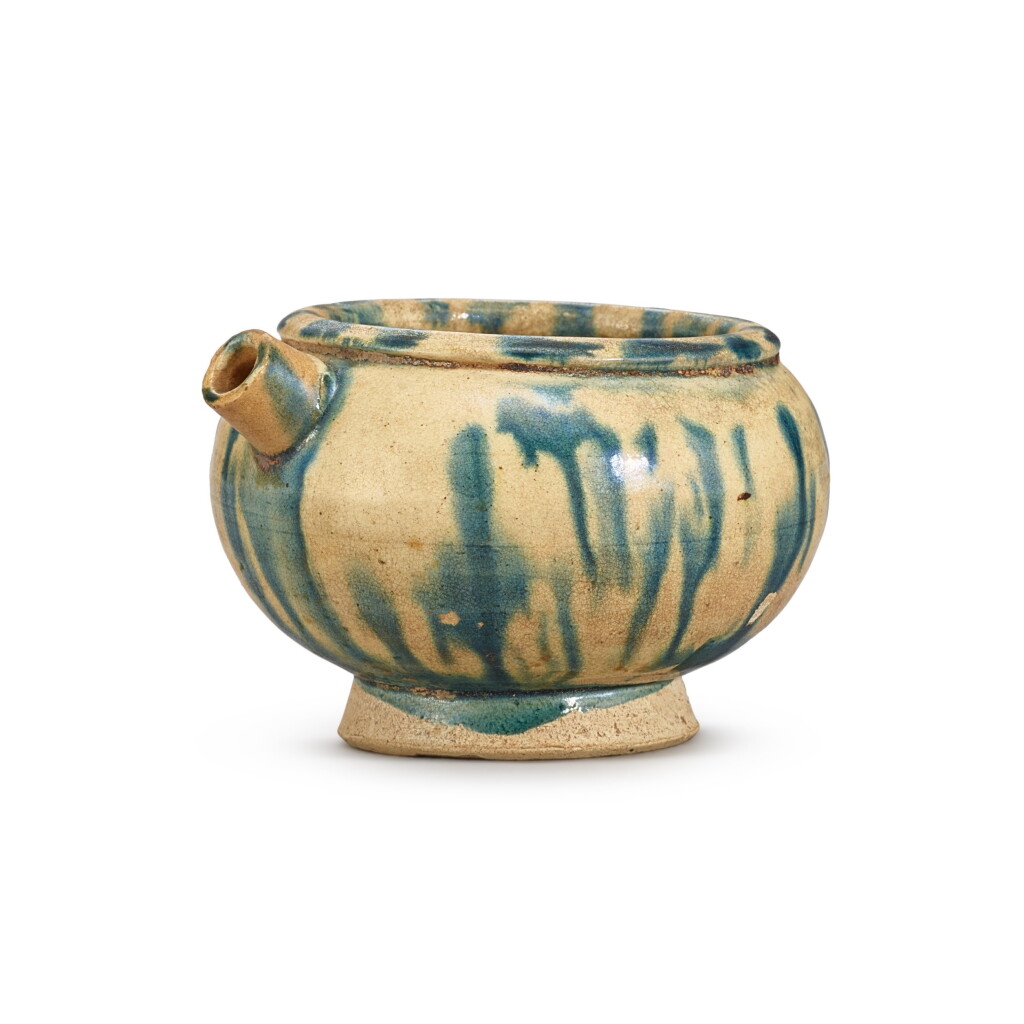 View full screen - View 1 of Lot 307. A blue-splashed jarlet, Tang dynasty 唐 藍彩短流小罐.