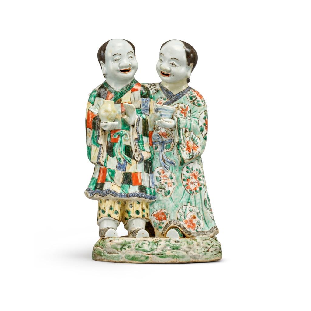 View full screen - View 1 of Lot 659. An unusual famille-verte 'Hehe Erxian' group, Qing dynasty, Kangxi period | 清康熙 五彩和合二仙擺件.