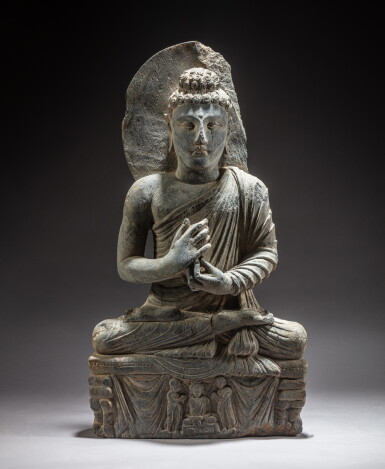 View full screen - View 1 of Lot 97. A gray schist seated figure of Buddha, Ancient region of Gandhara, circa 2nd / 4th century | 犍陀羅 約二 / 四世紀 灰片岩雕佛坐像.