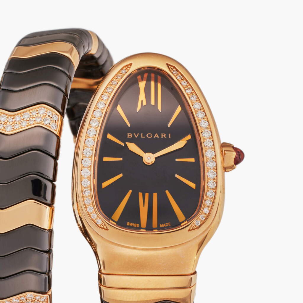 View full screen - View 1 of Lot 91. Reference SP P 35 G Serpenti Spiga | A black ceramic, pink gold, and diamond-set expandable bracelet watch, Circa 2020.
