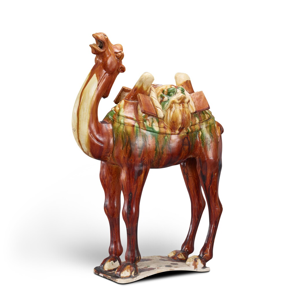View full screen - View 1 of Lot 814. A sancai-glazed figure of a camel Tang dynasty | 唐 三彩駱駝.
