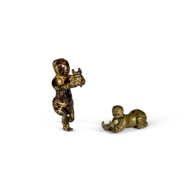 View full screen - View 1 of Lot 38. A small bronze figure of a kneeling boy and a small gilt-bronze figure of an adorant Ming dynasty | 明 鎏金銅童子像 及 銅童子像 一組兩件.