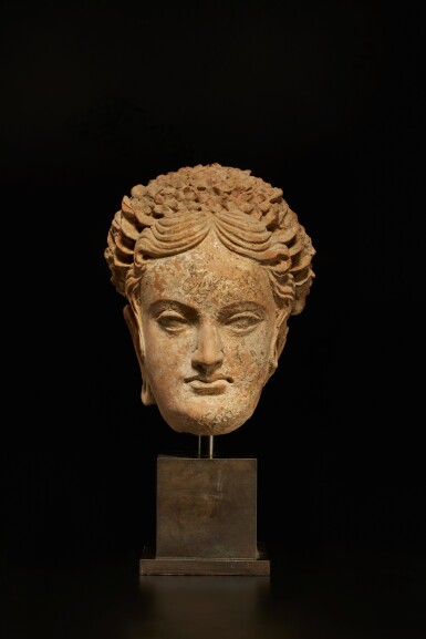 View full screen - View 1 of Lot 556. A terracotta head of a donor, Ancient Region of Gandhara, circa 5th century.