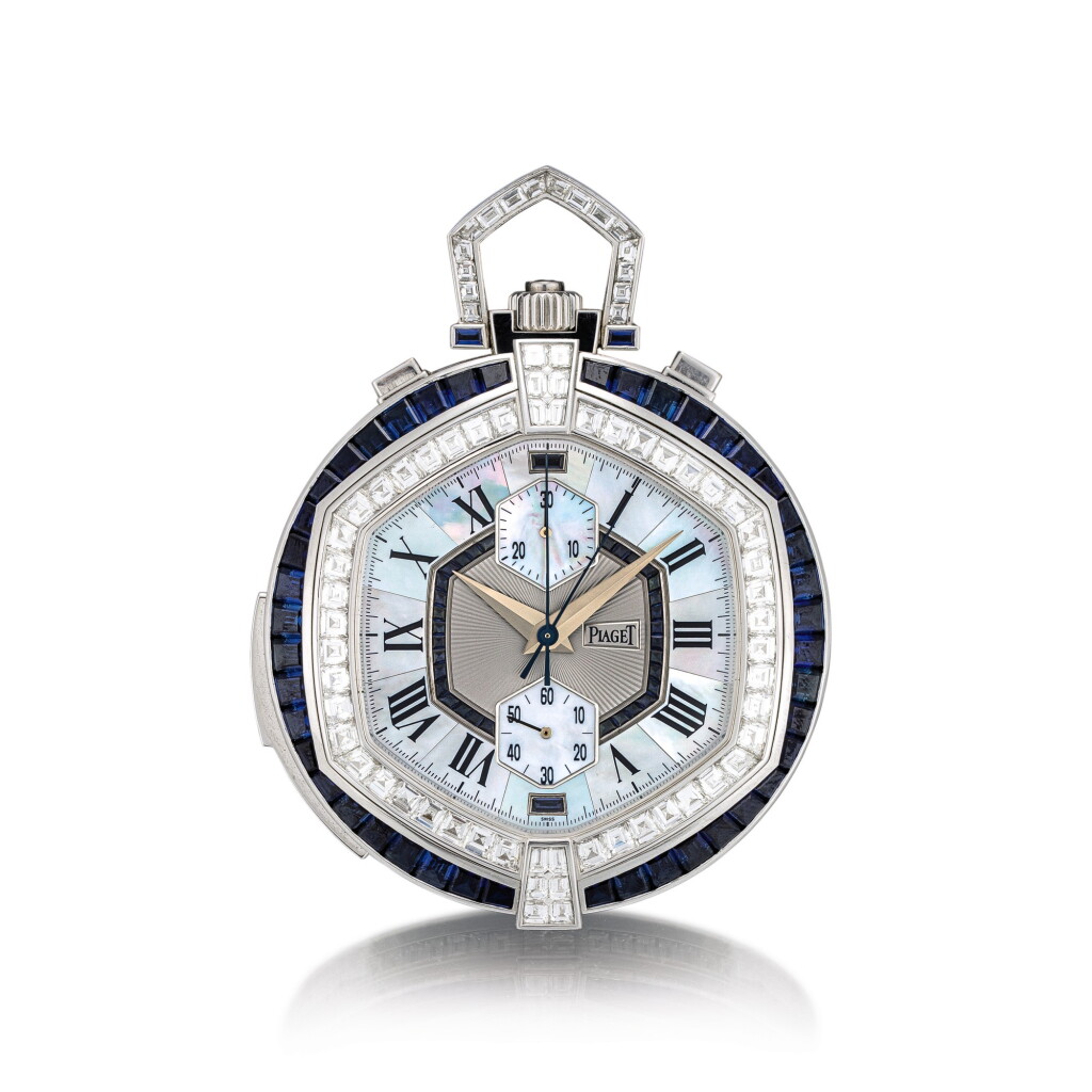 View full screen - View 1 of Lot 2032. Piaget | A unique white gold, diamond and sapphire-set minute repeating split seconds chronograph open face watch with mother-of-pearl dial and case back, accompanied by white gold, diamond, sapphire and crystal presentation stand, Circa 2000 | 伯爵 | 獨一無二白金鑲鑽石及藍寶石三問追針計時懷錶,備珠母貝錶盤及背蓋,附帶白金鑲鑽石、藍寶石及水晶展示座,約2000年製.