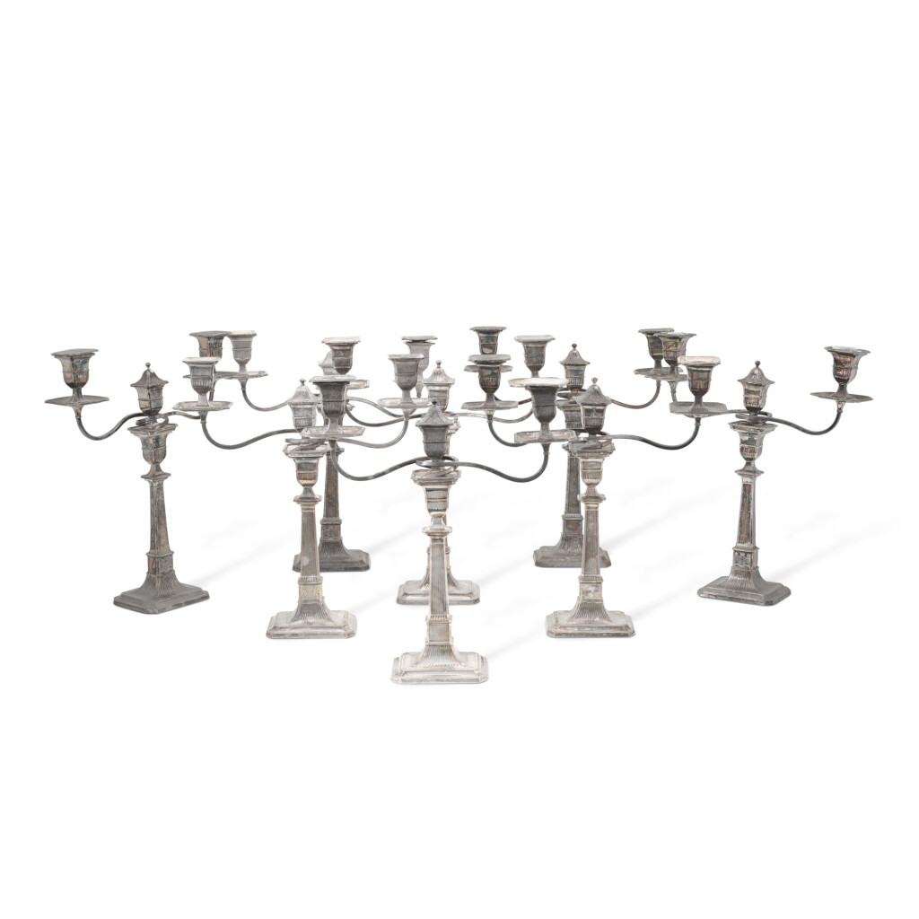 View full screen - View 1 of Lot 41. A set of eight Sheffield-plate two-light candelabra, early 19th century.