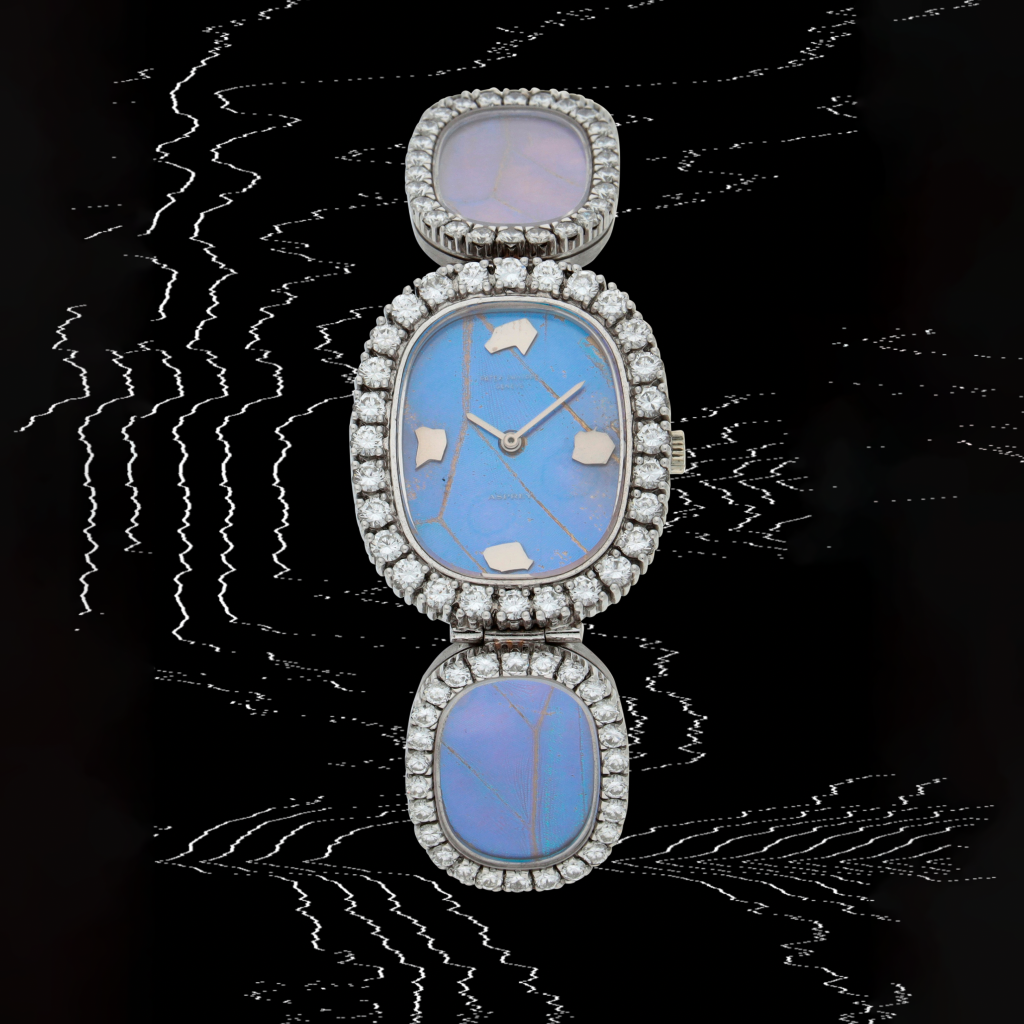 View full screen - View 1 of Lot 30. Retailed by Asprey: Reference 4117/1G | A white gold and diamond-set bracelet watch with butterfly wings dial and bracelet | Made in 1973.
