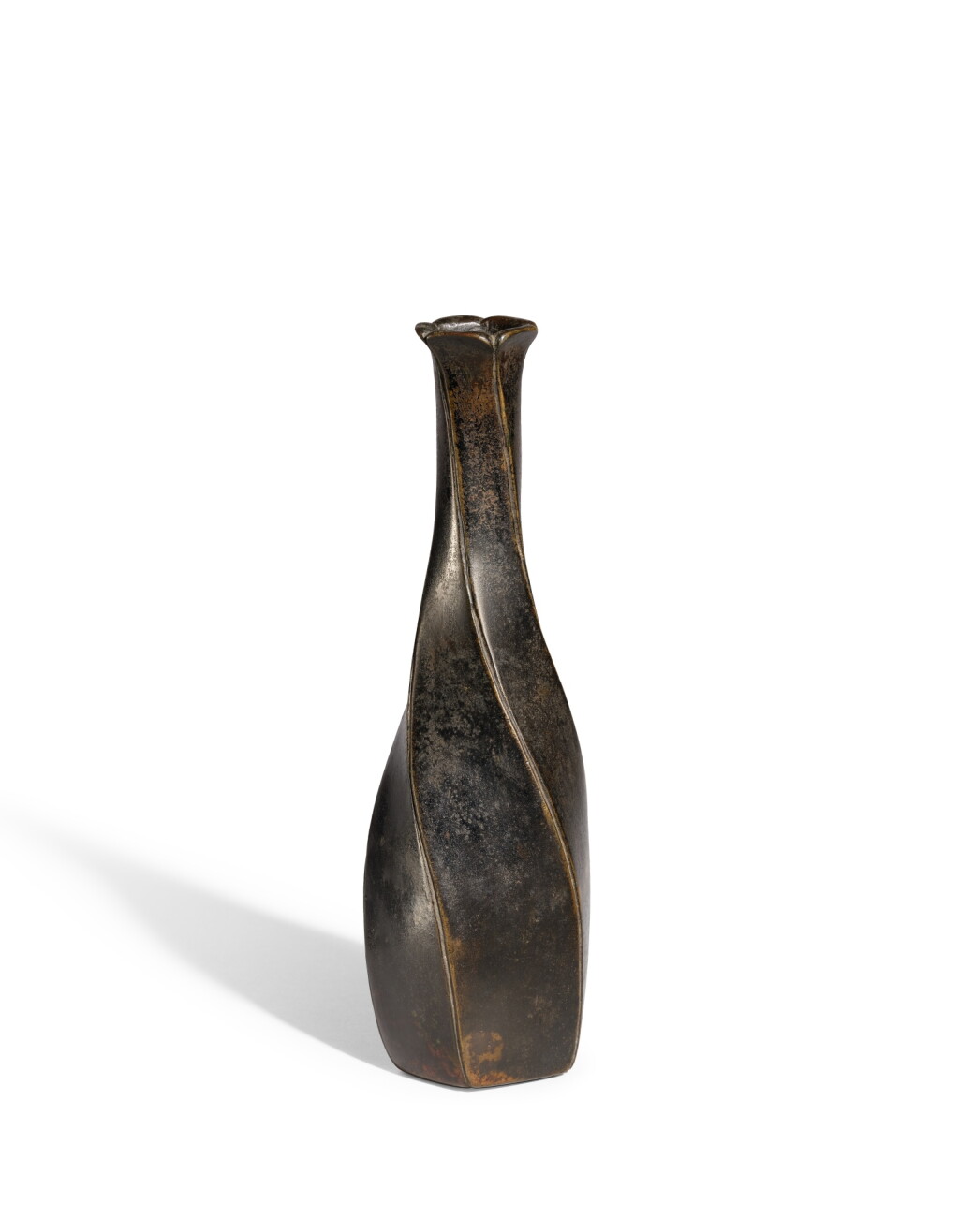 View full screen - View 1 of Lot 8020. A bronze faceted spirally-ribbed vase, Ming dynasty | 明 銅旋棱紋花口長頸瓶.
