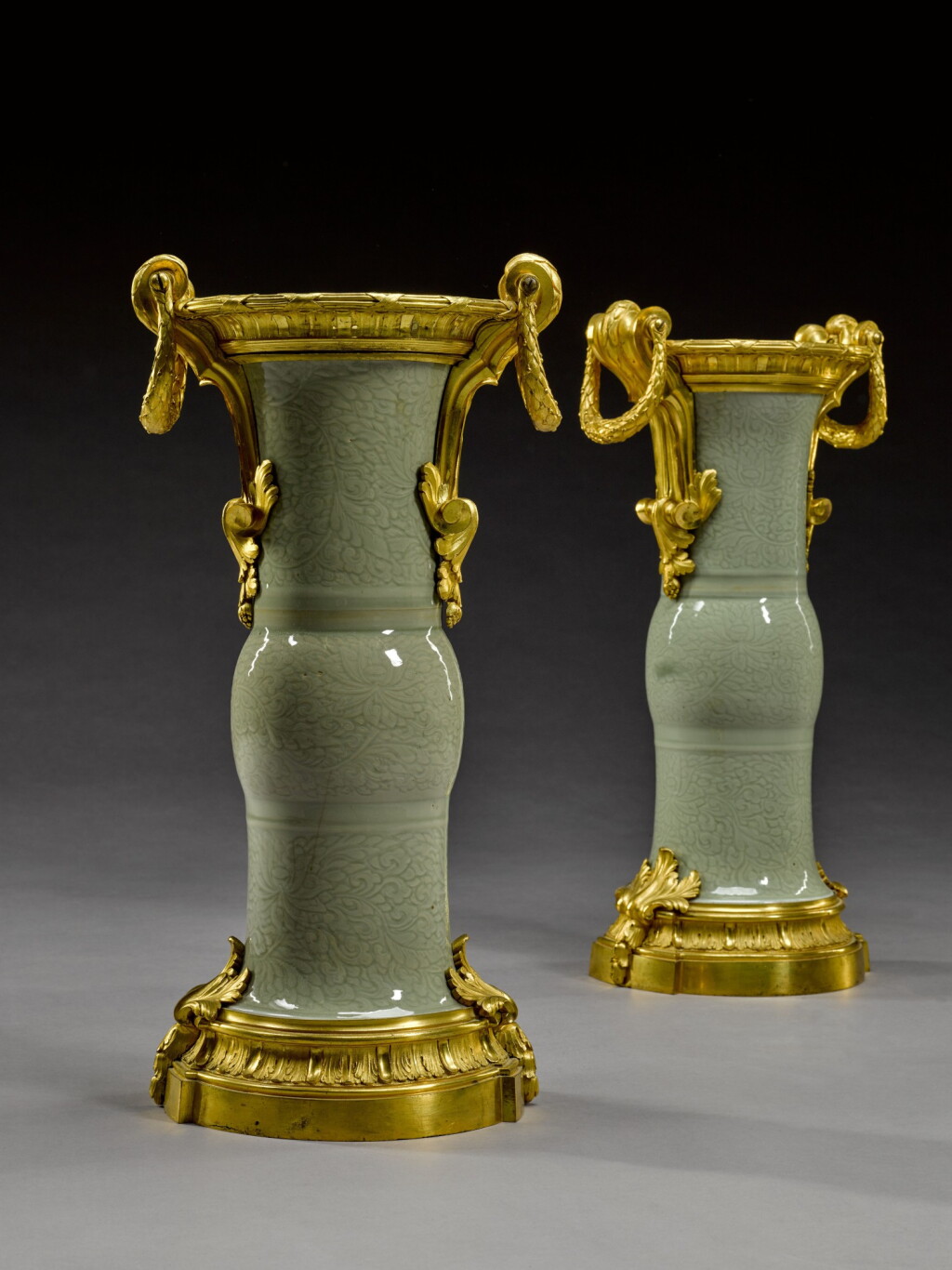 View full screen - View 1 of Lot 14. A pair of gilt-bronze mounted Chinese celadon porcelain vases, the porcelain Qianlong (1736-1795), the mounts Louis XV circa 1770.