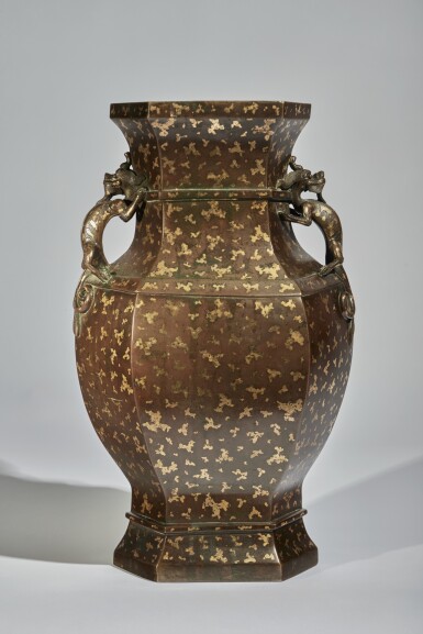 View full screen - View 1 of Lot 73. A Large Chinese Gold-Splashed Bronze Handled Vase, Qing Dynasty, 18th Century | 清十八世紀 銅灑金螭龍耳六方瓶.