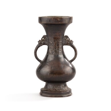 View full screen - View 1 of Lot 264. An archaistic bronze flattened two-handled baluster vase, Ming dynasty | 明 銅仿古獸面效雙耳扁壺.