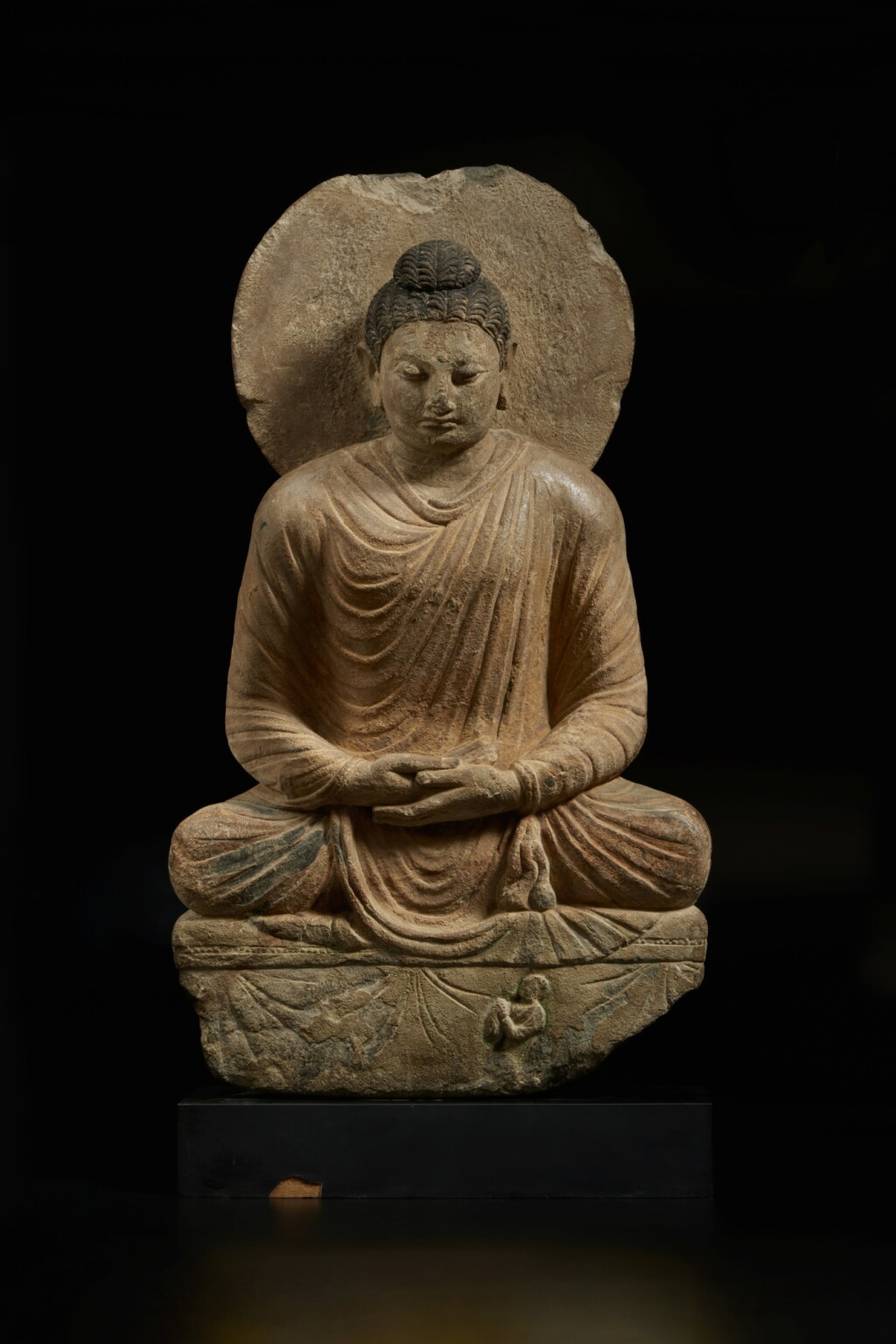 View full screen - View 1 of Lot 570. A painted gray schist figure of Shakyamuni Buddha, Ancient Region of Gandhara, 3rd / 4th century.