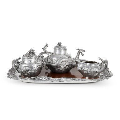 View full screen - View 1 of Lot 656. A Japanese Export Three Piece Silver Tea Set and Silver and Rosewood Two-Handled Tray, Early 20th Century.