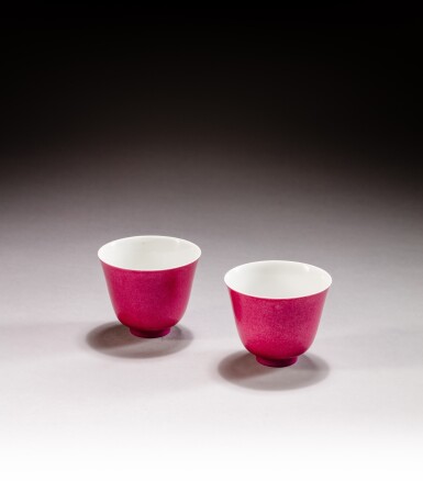 View full screen - View 1 of Lot 229. A pair of ruby-pink enameled wine cups, Marks and period of Yongzheng | 清雍正 胭脂紅彩小盃一對《雍正年製》款.