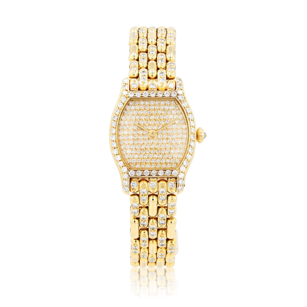 View full screen - View 1 of Lot 66. Cartier | Montre bracelet de dame or et diamants, "Tortue" | Lady's gold and diamond bracelet watch, 'Tortue'.