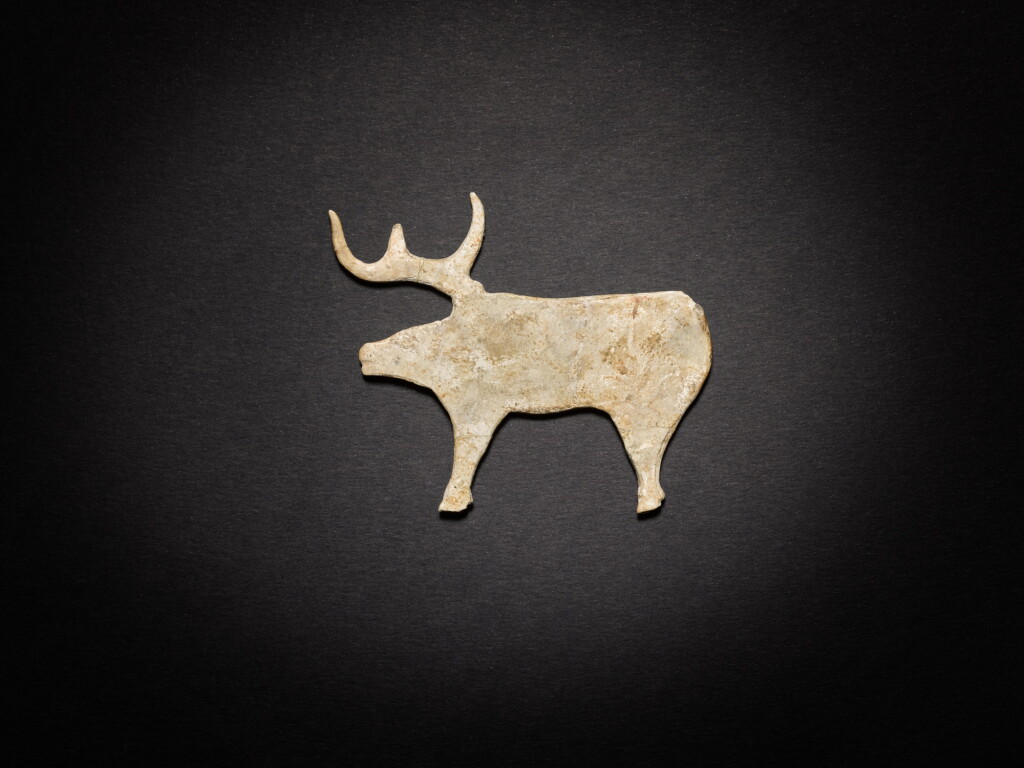 View full screen - View 1 of Lot 85. An archaic calcified jade 'deer' plaque, Shang dynasty.