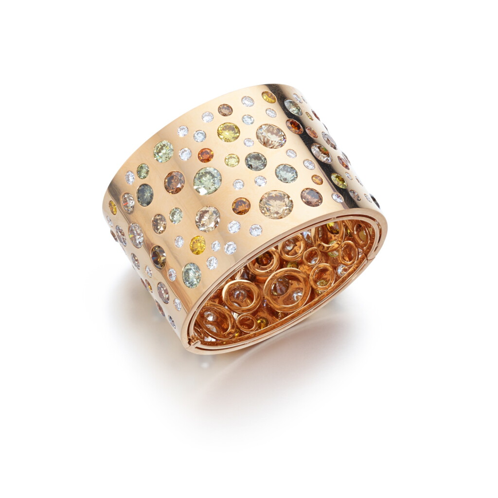 View full screen - View 1 of Lot 531. Coloured diamond and diamond bangle.