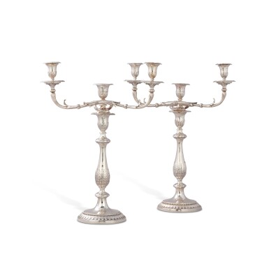 View full screen - View 1 of Lot 126. A matching pair of large George III silver three-light candelabra, one by John Scofield, London, 1791, the other by Richard Cook, London, 1807.
