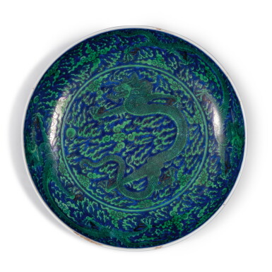 View full screen - View 1 of Lot 122. A blue-ground green-enameled ‘dragon’ dish, Mark and period of Kangxi | 清康熙 青花地綠彩趕珠雲龍紋盤 《大清康熙年製》款.