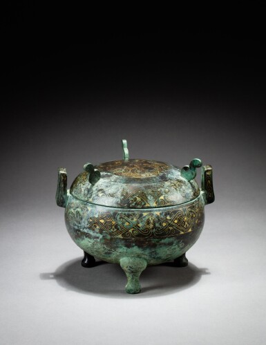 View full screen - View 1 of Lot 27. An archaic bronze gold-inlaid vessel and cover, ding, Warring States period - Han dynasty | 戰國時期至漢 銅錯金瑞獸紋蓋鼎.