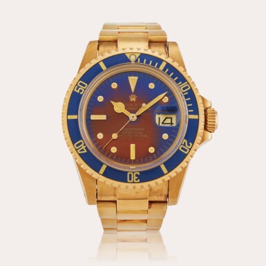 View full screen - View 1 of Lot 616. Reference 1680 Submariner | A yellow gold automatic wristwatch with date, bracelet, and tropical nipple dial, Circa 1978.