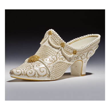 A ROYAL WORCESTER RETICULATED PORCELAIN MODEL OF A SHOE BY ...