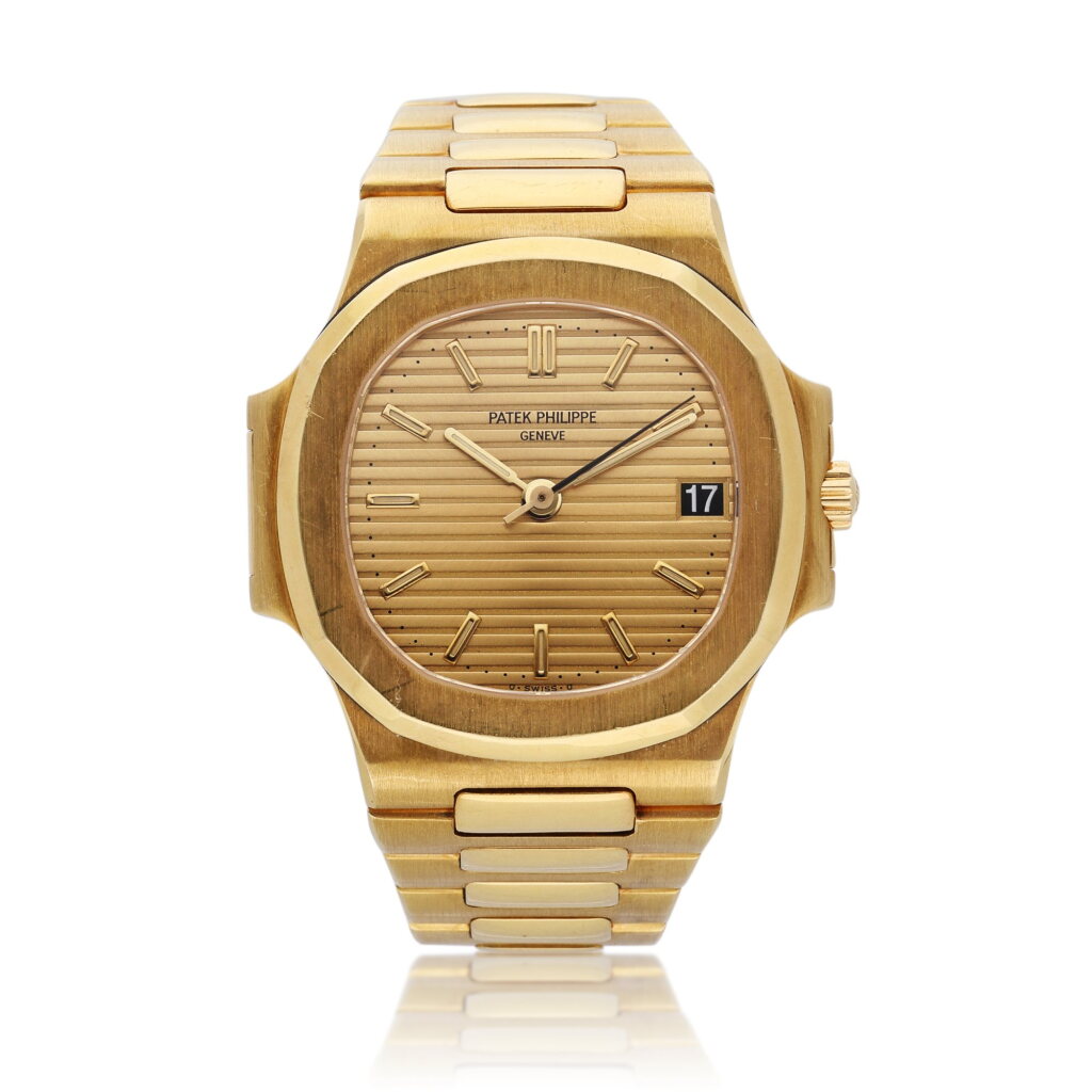 View full screen - View 1 of Lot 4. Reference 3800/1 Nautilus | A yellow gold automatic wristwatch with date and bracelet, Circa 1985 .