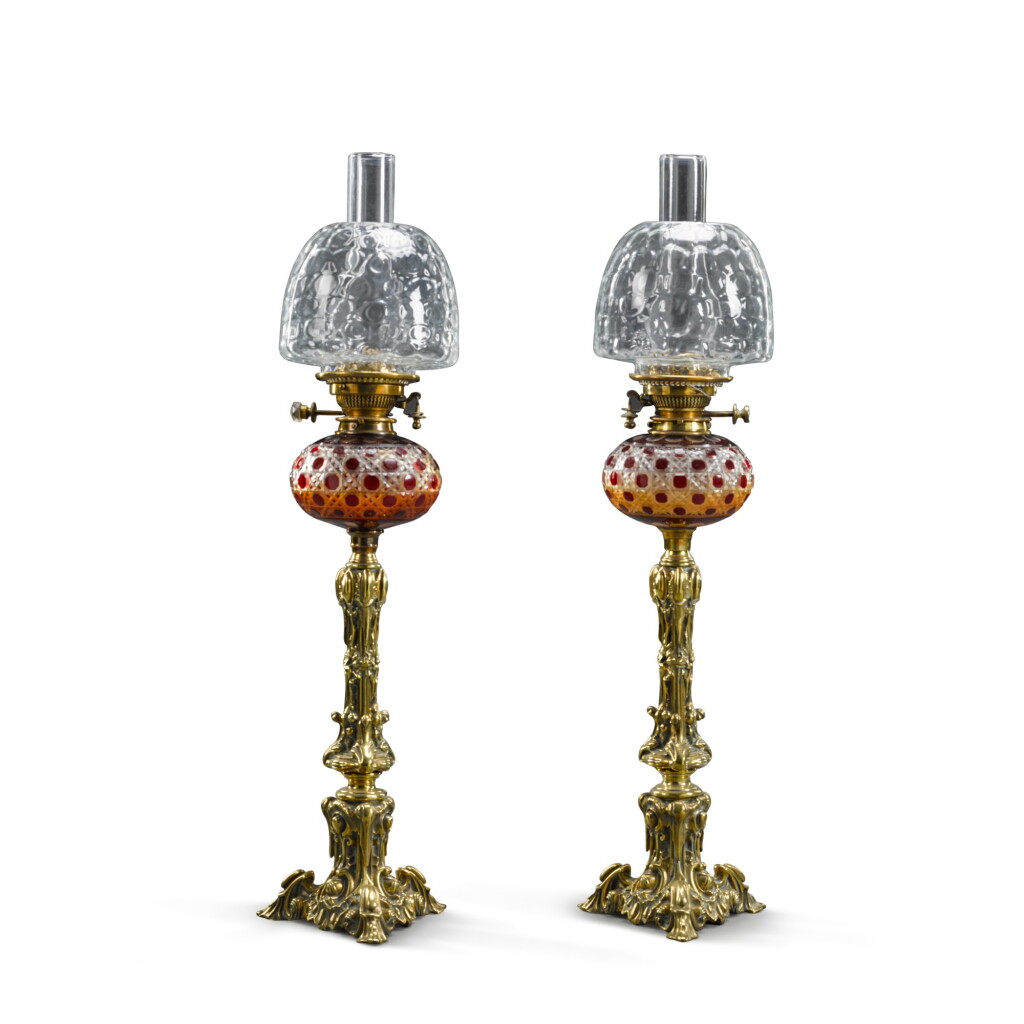 View full screen - View 1 of Lot 67. A pair of Victorian brass and ruby cut-glass 'Hink's Duplex Patent' oil lamps, circa 1885.
