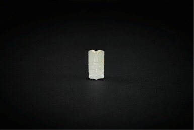 View full screen - View 1 of Lot 3785. A white jade 'mask' bead, Neolithic period, Liangzhu culture or middle Yangzi region, 2500-2000 BC | 新石器時代 良渚或長江中游文化 公元前二千五至二千年 白玉神人獸面紋管飾.