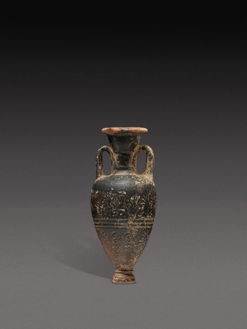 View full screen - View 1 of Lot 104. An Attic Black-glazed Pointed Amphoriskos, circa late 5th Century B.C..