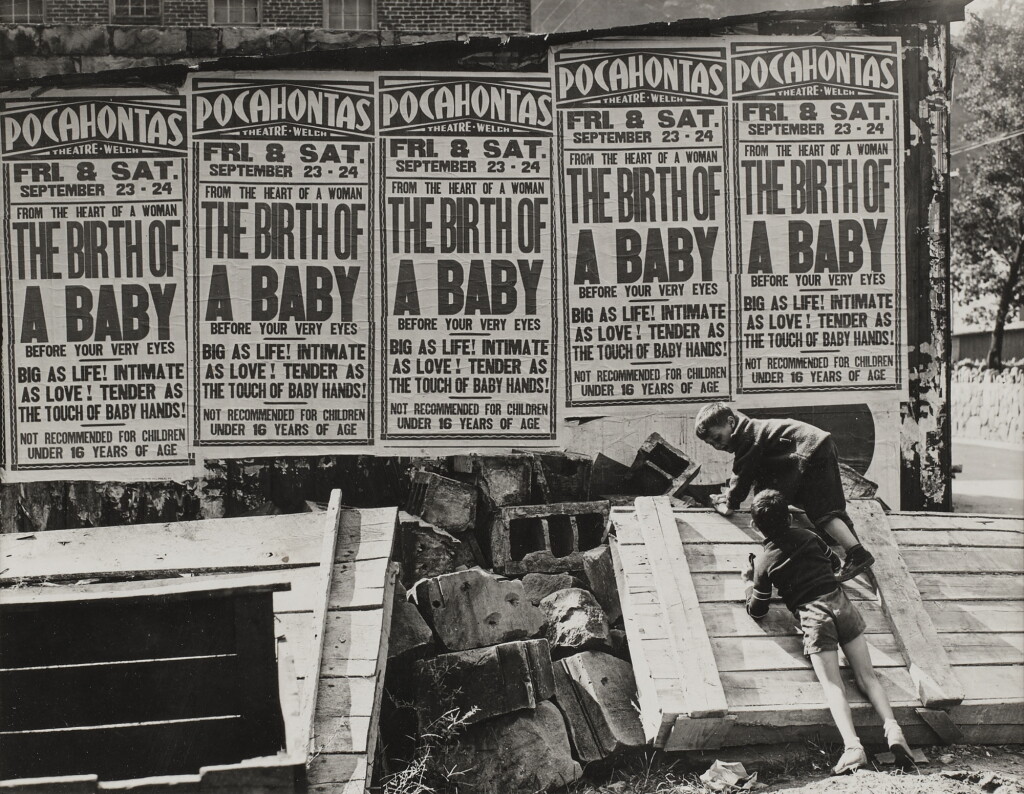 View full screen - View 1 of Lot 921. Movie advertisement on side of building, Welch, W. VA..