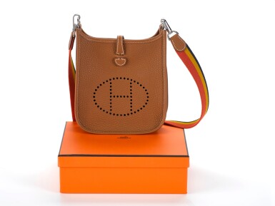 View full screen - View 1 of Lot 17. EVELYNE III 16 GOLD COLOUR IN TOGO LEATHER WITH PALLADIUM HARDWARE AND RAINBOW STRAP. HERMÈS, 2018 .