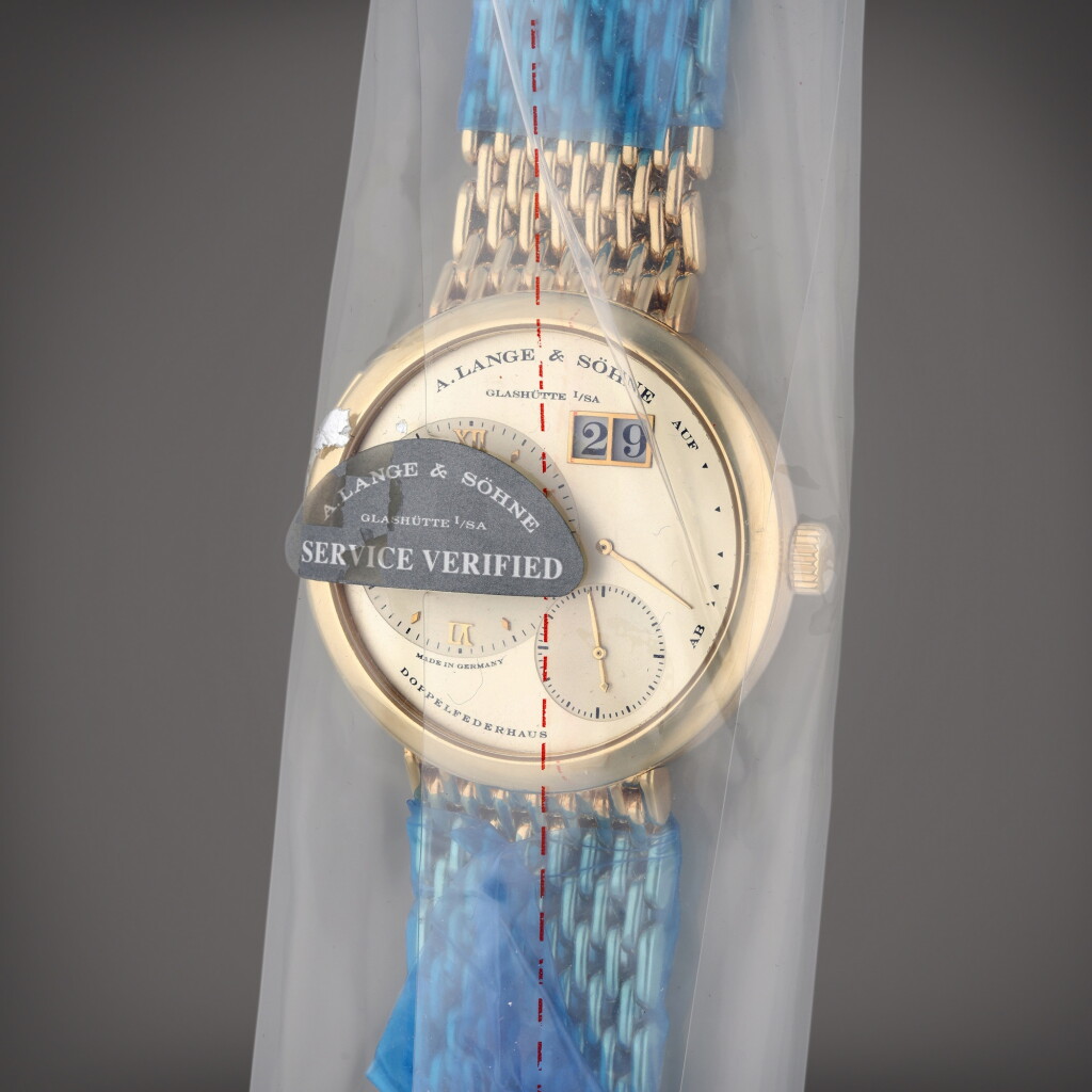 View full screen - View 1 of Lot 244. Reference 101.321 Lange 1 | A yellow gold bracelet watch with date and power reserve indication, Circa 2005.